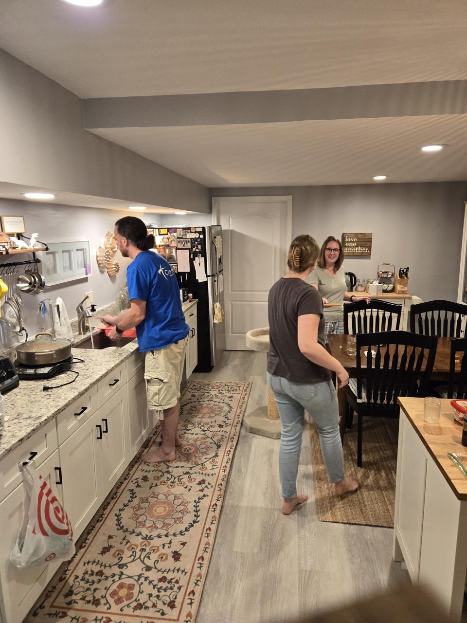 Janine, Jeremy, and Cassie in the kitchen